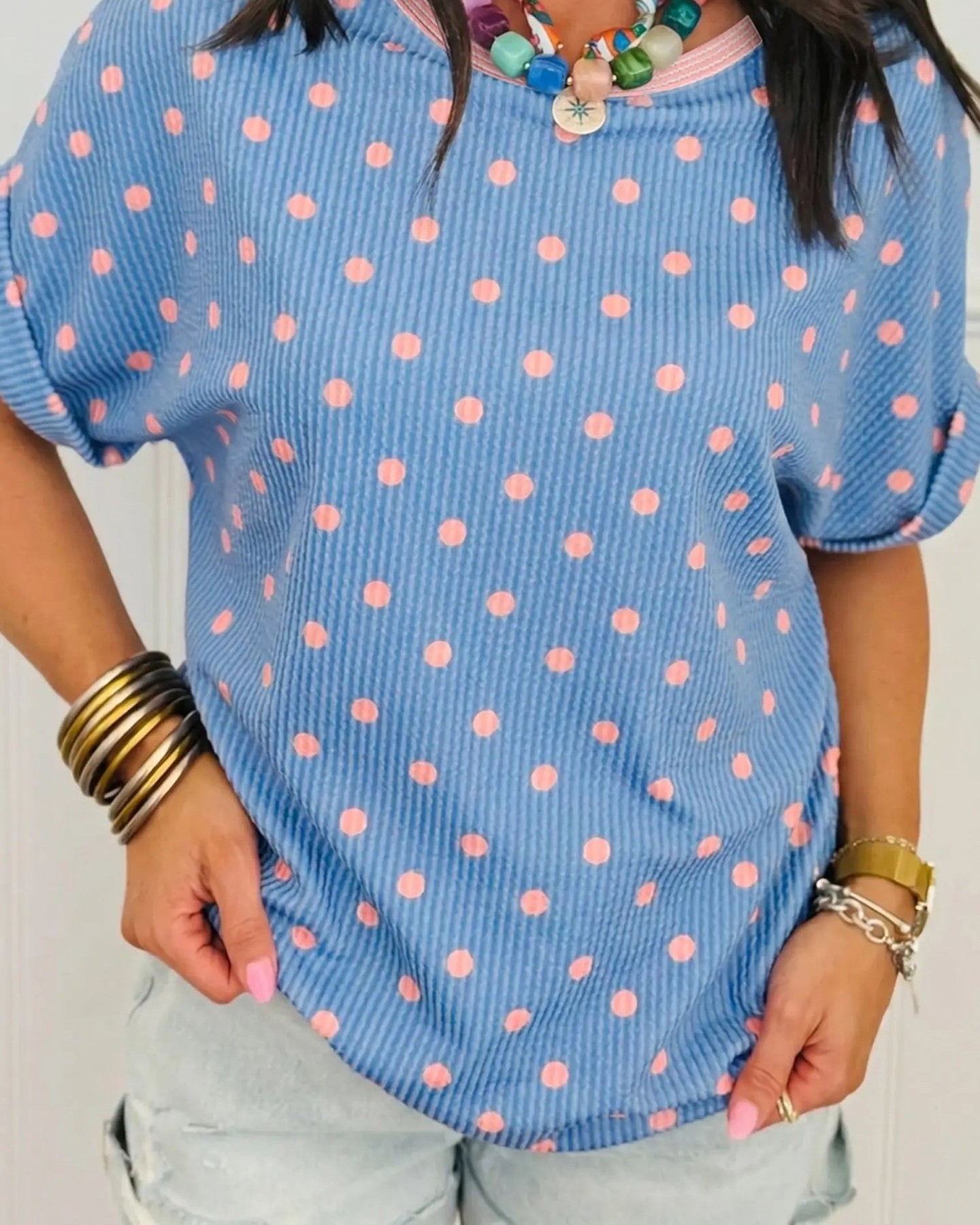 Your everyday wardrobe just got a major upgrade. This raised rib polka dot top combines playful style with effortless comfort—the tactile texture and cuffed sleeves deliver that fashion-forward look without trying too hard. Perfect for summer casual days that actually feel put-together.

#PolkaDotTop #RibbedTop #SummerStyle #CasualChic #FashionForward