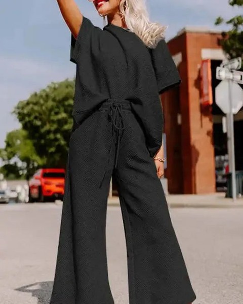 That moment when you slide into a set that feels like a hug and looks effortlessly put-together.

The Black Textured Loose Fit Tee and Drawstring Pants Set is your new go-to for days when you want comfort without compromising style. Textured fabric, adjustable drawstring, and a relaxed fit that works everywhere — from lazy mornings at home to casual outings.

Now at £31.56, this two-piece co-ord does all the thinking for you.

#LoungewearSet #CoordOutfit #ComfyStyle #BlackEverything #SetGoals