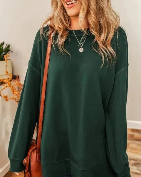 Oversized silhouettes are dominating street style right now—and this split hem sweatshirt is your answer.

Drop shoulders + quirky duffel design = effortless comfort that actually looks intentional. Pair with jeans for laid-back vibes or dress it up with a skirt.

#OversizedSweatshirt #StreetStyle #WomensFashion #CasualWear #FallFashion